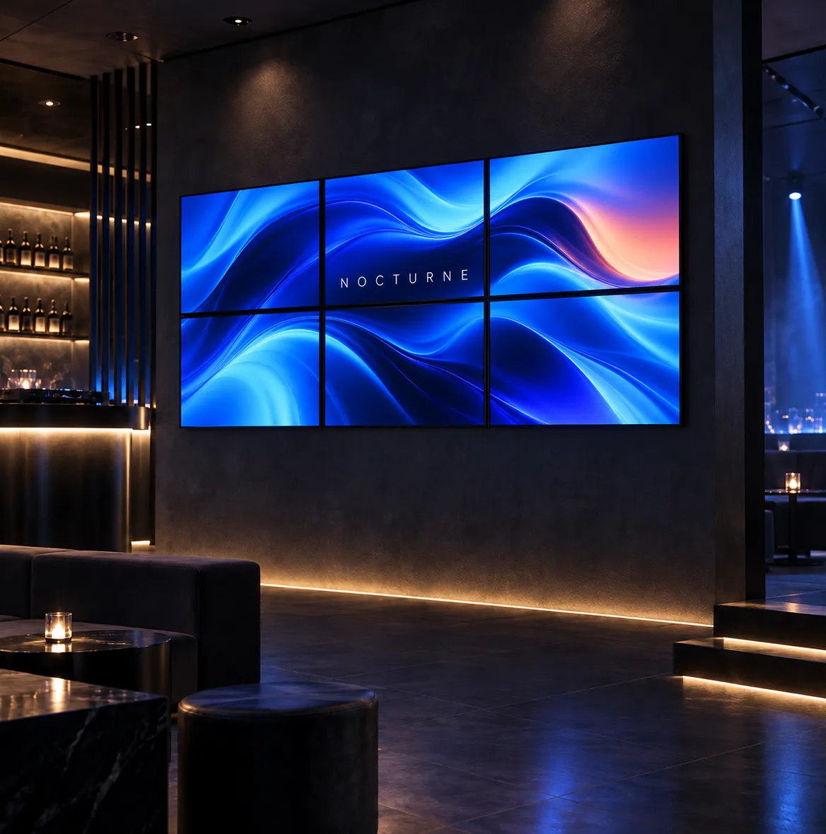 Videowall de seis pantallas con olas azules en una sala oscura